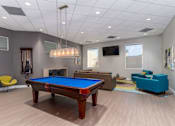 Thumbnail 27 of 27 - A room with a pool table and a fireplace at Nola 624 Apartments, West Covina