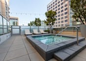 Thumbnail 4 of 104 - A small pool on a balcony with a chair and a table