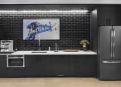 Thumbnail 25 of 84 - Community kitchen with stainless steel appliances at The Promenade Rio Vista, California