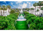 Thumbnail 2 of 84 - Exterior View of The Promenade Rio Vista Apartments Building Surrounded By Lush Landscaping with View of the Courtyard at The Promenade Rio Vista, California, 92108