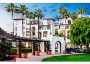 Thumbnail 3 of 84 - exterior of apartment building with palm tree landscaping at The Promenade Rio Vista, San Diego, CA
