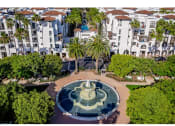 Thumbnail 5 of 84 - aerial view of promenade rio vista apartments and water fountain with lush landscaping at The Promenade Rio Vista, San Diego, California