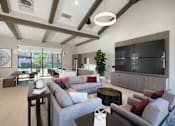 Thumbnail 5 of 87 - Clubroom with a grey sofa and a television.
