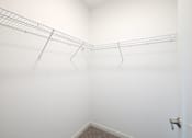 Thumbnail 49 of 87 - A white wall with a metal rack on it.