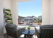 Thumbnail 51 of 87 - A patio with a table and chairs overlooking a street.