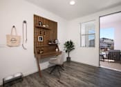 Thumbnail 50 of 87 - A room with a chair and a shelf with a plant on it.