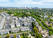 Thumbnail 73 of 85 - A suburban area with apartment buildings and downtown sacramento in the distance