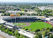 Thumbnail 80 of 85 - A large stadium with a green field in the center and a yellow sign that says "Catch the Game".