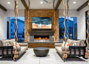Thumbnail 15 of 85 - Outside fireplace with lounge seating