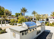 Thumbnail 35 of 85 - A silver outdoor kitchen with a grill