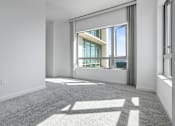 Thumbnail 64 of 104 - A sunny day with a view of the sky through a window at The Grand Apartments, Oakland, CA, 94612