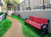 Thumbnail 7 of 59 - Gated Dog Park With Lush Green Grass at The Preston Miracle Mile Apartments, Los Angeles, 90036