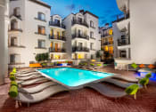 Thumbnail 8 of 59 - Swimming Pool With Relaxing Sundecks at The Preston Miracle Mile Apartments, Los Angeles, CA, California, 90036