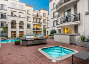 Thumbnail 9 of 59 - Resort-Inspired Pool Area With A Sparkling Pool at The Preston Miracle Mile Apartments, Los Angeles, California