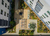 Thumbnail 120 of 137 - A courtyard surrounded by buildings with a fountain at Trestle, Monrovia, CA, 91016