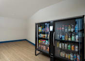Thumbnail 106 of 137 - A black refrigerator filled with various drinks and food items.
