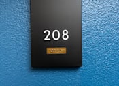 Thumbnail 23 of 137 - A black door with the number 208 on it.