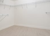Thumbnail 56 of 137 - A room with a white wall and a wooden floor.