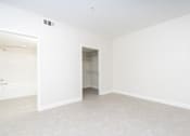 Thumbnail 62 of 137 - A large empty room with a doorway leading to another room.