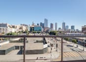 Thumbnail 23 of 26 - A cityscape with a clear blue sky and buildings of various heights at Wilshire Valencia Apartment, Los Angeles, CA