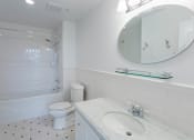 Thumbnail 39 of 44 - a white bathroom with a white toilet and a sink at Vendome Place, California