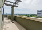 Thumbnail 43 of 44 - Studios in Downtown San Jose, CA - Vendome Place - Terrace with City View, Pillars, and String Lights.