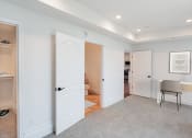 Thumbnail 30 of 44 - a living room with white doors and a carpeted floor at Vendome Place, California