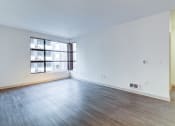 Thumbnail 20 of 51 - Empty Living Room with Hardwood-Style Flooring and a Large Window at Venue, San Francisco, CA