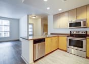 Thumbnail 23 of 51 - unfurnished kitchen with stainless steel appliances at Venue, San Francisco, CA, 94158