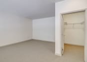 Thumbnail 33 of 51 - an empty room with a closet and a door open at Venue, San Francisco, CA