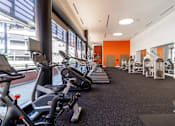 Thumbnail 45 of 51 - A gym with exercise bikes and treadmills.