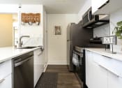 Thumbnail 20 of 39 - Apartments For Rent In East Village, CA - Vera Cortez Hill - Fully-Equipped Kitchen With Stainless Steel Appliances at Vera Cortez Hill, San Diego, CA