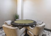 Thumbnail 9 of 34 - a round table for card games at Waterford RiNo, Denver