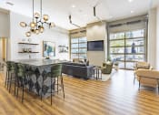 Thumbnail 1 of 34 - Clubroom with lounge seating and a TV at Waterford RiNo, Denver, CO 80216