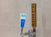 Thumbnail 10 of 34 - Cold brew station and sparkling water on tap at Waterford RiNo, Denver, CO