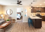 Thumbnail 9 of 16 - Living and kitchen area with entry to bedroom at Driftwood, San Diego, CA