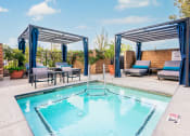 Thumbnail 47 of 52 - Jacuzzi with Chairs, Cabbanas with Lounge Seating and Cushions, and Brick Fence. at Westlake Canyon, Thousand Oaks, CA