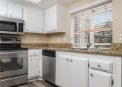 Thumbnail 35 of 52 - renovated kitchen with white cabinets at Westlake Canyon, Thousand Oaks, California