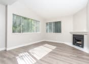 Thumbnail 23 of 52 - Living Room with Wood-Style Flooring and an Interior Fireplace at Westlake Canyon, California