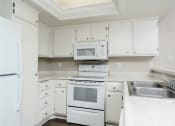 Thumbnail 30 of 52 - Two Bedroom Apartments in Thousand Oaks CA - Westlake Canyon - White Kitchen with Modern Appliances at Westlake Canyon, Thousand Oaks, 91362