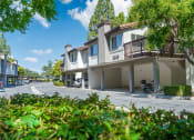 Thumbnail 11 of 52 - Building Exterior with Car Ports and Surrounding Greenery at Westlake Canyon, Thousand Oaks, CA 91362
