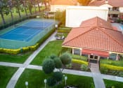 Thumbnail 3 of 40 - Leasing office and tennis court aerial view at Woodbend, Alta Loma, CA