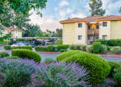 Thumbnail 5 of 40 - Building exterior and covered parking at Woodbend, Alta Loma, 91701