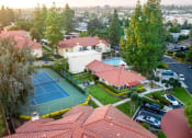 Thumbnail 6 of 40 - Aerial view of tennis court, parking and leasing office at Woodbend, California