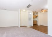 Thumbnail 23 of 40 - Living room, dining area with in unit washer and dryer at Woodbend, Alta Loma, 91701