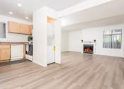 Thumbnail 36 of 40 - Livingroom and kitchen with in unit washer and dryer at Woodbend, Alta Loma, California