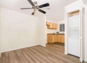 Thumbnail 38 of 40 - Dining area with ceiling fan and in unit washer and dryer at Woodbend, California