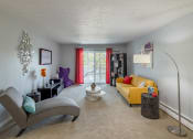 Thumbnail 1 of 20 - a living room with a yellow couch and a chair and a table