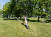 Thumbnail 18 of 20 - a slide in the middle of a park