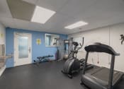 Thumbnail 15 of 20 - a gym with treadmills and other exercise equipment inside of a building